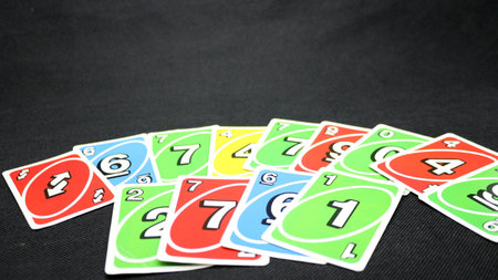 Colorful cards scattered on a black backgroundの写真素材