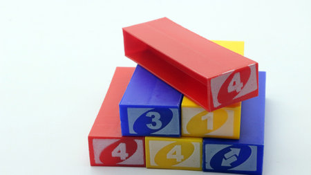 Colorful stacko blocks being played on a white background