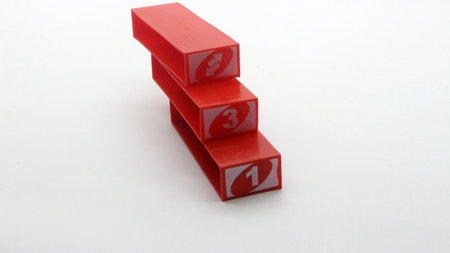 Colorful stacko blocks being played on a white background