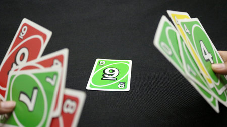 Colorful cards scattered on a black backgroundの写真素材