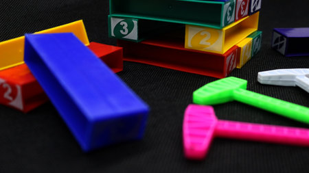 Colorful stackable blocks being played on a black backgroundの写真素材