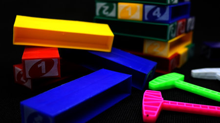Colorful stackable blocks being played on a black backgroundの写真素材