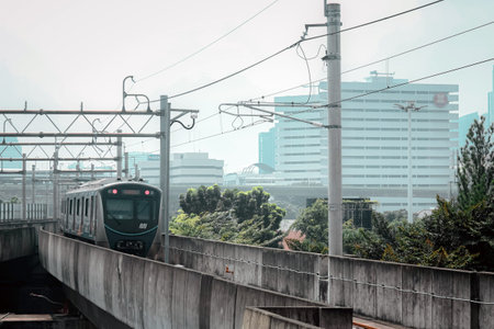 Commuter trains are used as public transportation in the city of Jakarta