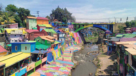 Colorful village with pedestrian bridge and clear sky in Malang Indonesia