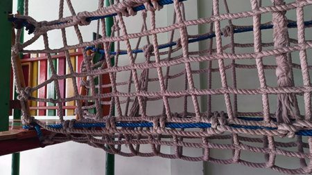 Close up of rope climbing net in playground for children activity