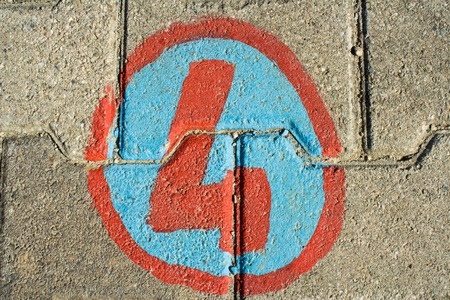 Number four painted on bricks in the floor