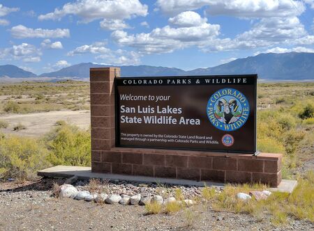 San Luis Lakes State Wildlife Area overlooks the Great Sand Dunes National Park.  The park is home to enormous sand dunes up to 700 feet high, an unusual sight in the middle of the Rocky Mountains!のeditorial素材
