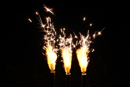 Cake fireworks candle firing on black backgroundの写真素材
