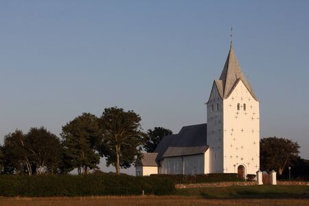 Denmark, Ribe, Vester Vedstet, 23 August 2013 - 19th century traditional rural church at sunsetのeditorial素材