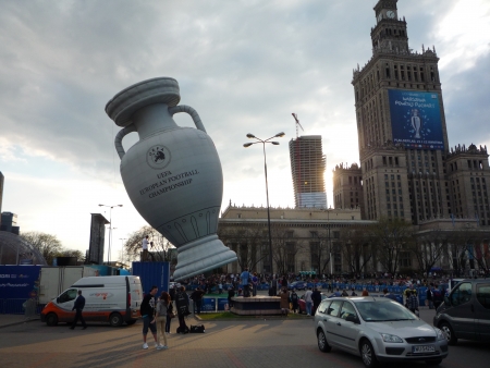 Poland, Warsaw, plac Defilad, 22 April 2012 - UEFA balloon in the shape of European Championship Cup with Palace of Culture and Zlota 44 residential tower under construction by Daniel Libeskind in the backgroundのeditorial素材