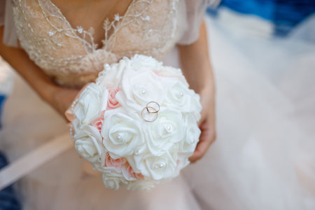 wedding bouquet in the hands of the bride