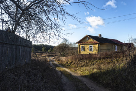 Old wooden house on a country road in the village. Russia.の写真素材