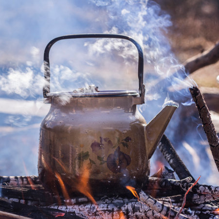 Kettle on the fire in the forest. camping concept.の写真素材