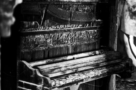 Old wooden piano in black and white. black and white photo.の写真素材