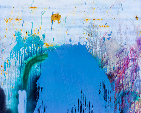 abstract background with blue and yellow paint splashes on the wall