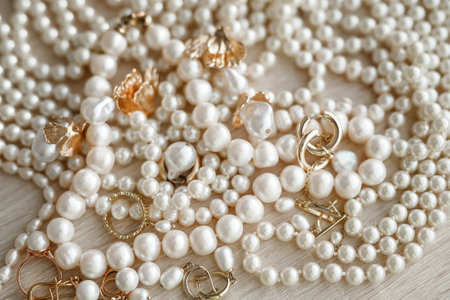 Jewelry background with pearls and earrings, close upの写真素材