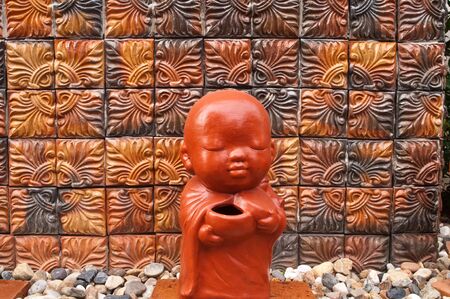 monk statue of a Thai templeの写真素材