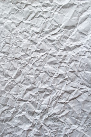 Crinkled sheet of white paper for backgroundの写真素材