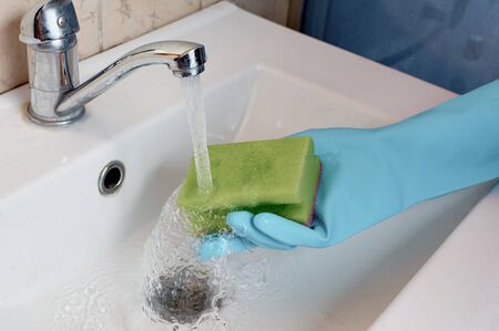 Uboka in the bathroom. Cleaning the sinkの写真素材