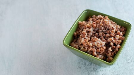 Cooked buckwheat porridge. Porridge in a bowl on the table. Copy space.の写真素材