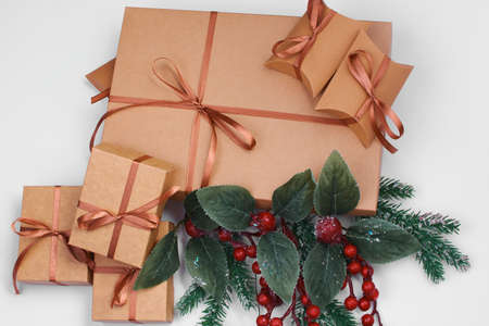 A Christmas gift. Box with brown satin ribbon on a white background