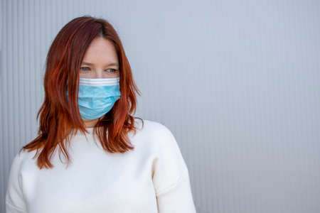Masked woman due to air pollution or viral epidemic in the city