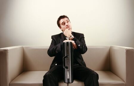 Businessman relaxing on loungeの写真素材