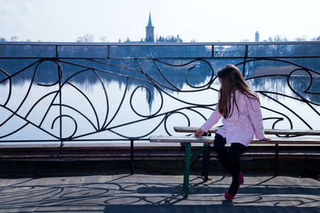 the girl on the benchの写真素材