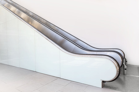 escalator shopping mall in wide angle without people high key white color