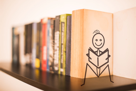 Books on a wooden book with a book on a bookの写真素材