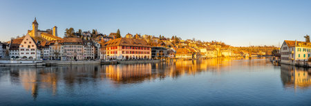 Schaffhausen, Switzerland - 4th March 2022: Rhine river bank during evening golden hour