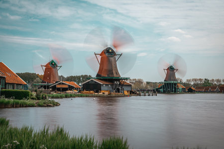 Long exposure photos of beautiful windmills in Zaanse Schansのeditorial素材