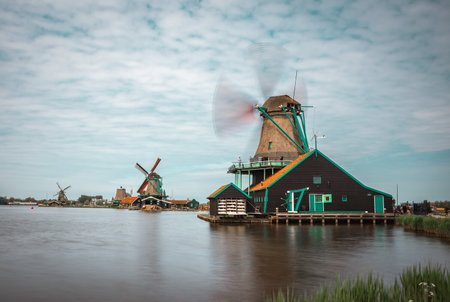 Long exposure photos of beautiful windmills in Zaanse Schansのeditorial素材