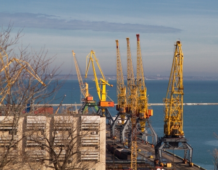 Cargo crane, ship and grain dryer in port Odessa, Ukraineの写真素材