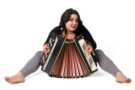 beautiful young brunette with accordion isolated on white background