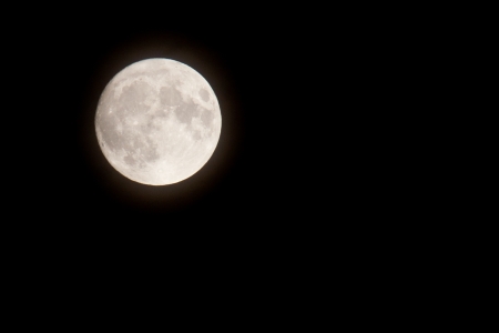 Glowing full moon with plenty of space for textの写真素材