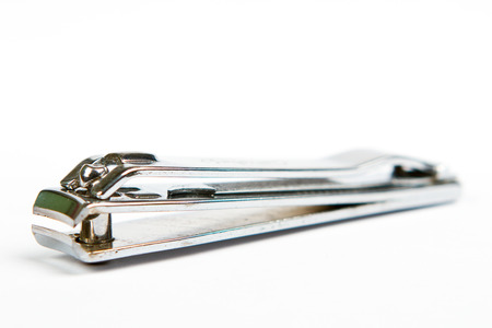 metal tongs nails isolated on white backgroundの写真素材