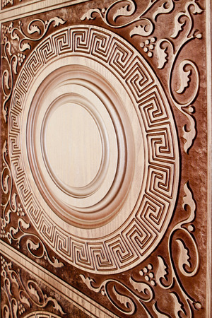 fragment beautiful carved brown wooden door with an emphasis on designの写真素材