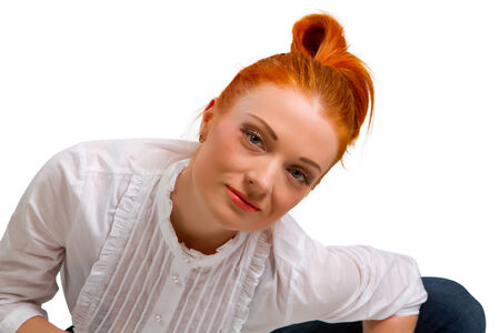 beautiful red-haired girl in a white blouse isolated on a white background