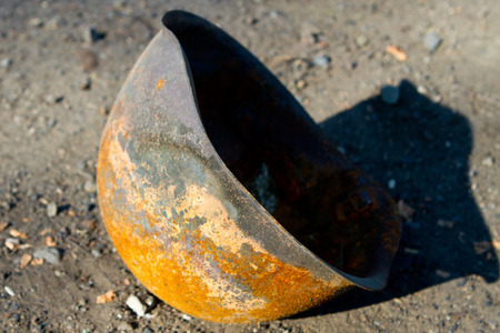 Burned army helmet on the site of fierce fighting in Donetsk republicの写真素材
