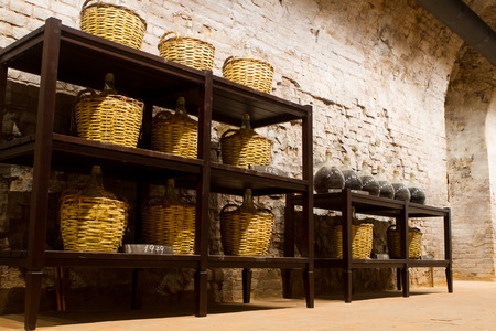 manufacture of wooden barrels in the factory,wine barrels with a candle in a cellarの写真素材