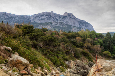 Rocky Mountain Peak with forest on hillside Ai-petri Crimea Landscape Summer day with blue sky on backgroundの写真素材