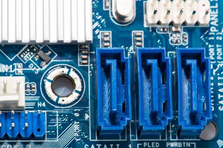 Digital hardware closeup. Microchips assembly on the circuit board macro
