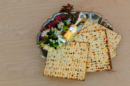 Top view and matzoh jewish passover bread over wooden background.の写真素材