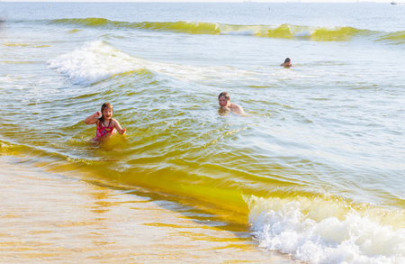children swim in the ocean happy little girl and boy in the seaの写真素材