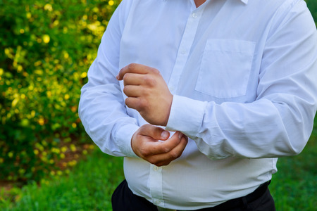Hands of wedding groom getting ready in suit hand groom bride preparing for the wedding