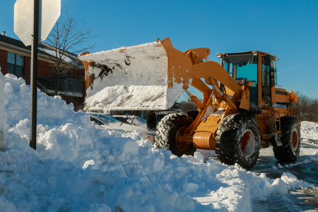 Snow removal vehicle removing snow snow tractor snow removalの写真素材