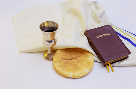 Chalice with red wine, bread and Holy Bibleの写真素材