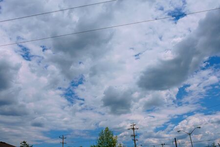 High-voltage support. clouds in the sky - scale power plant danger. power plant at sunset. electricsの写真素材