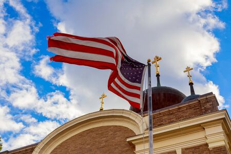 American flag and religious cross at sunset American Flag Churchの写真素材